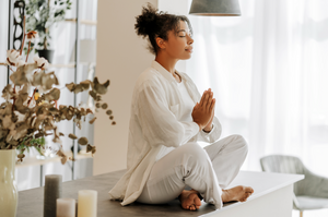 Woman meditating at home