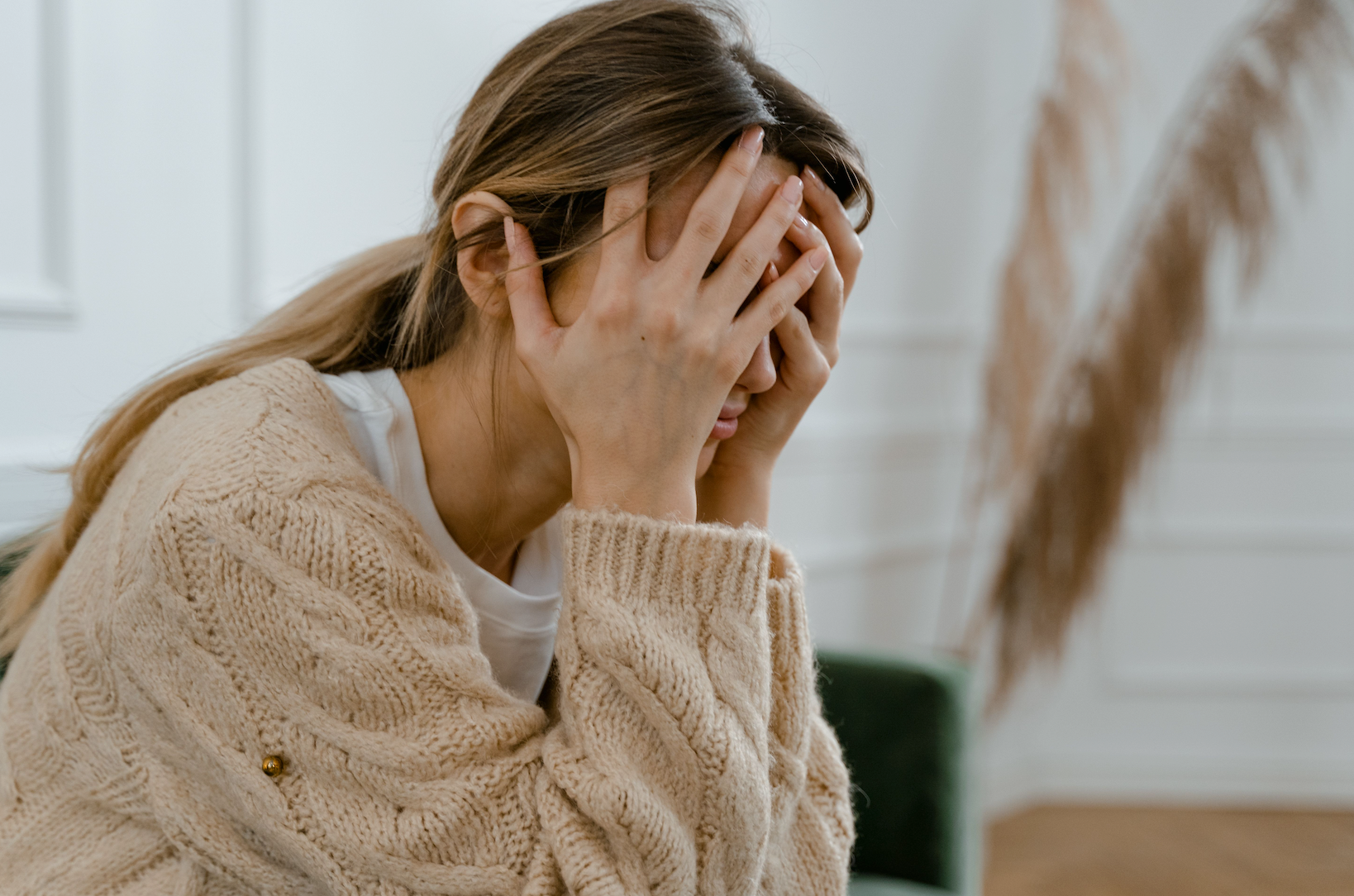 Woman holding her face of anger